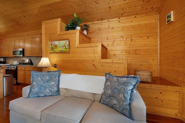 living area featuring wooden ceiling, wood walls, and hardwood / wood-style flooring