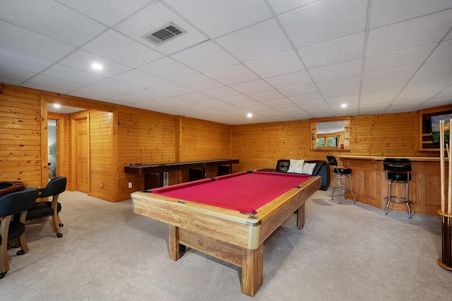 playroom with light colored carpet, a drop ceiling, wood walls, and pool table