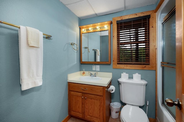 full bathroom with bath / shower combo with glass door, vanity, and toilet