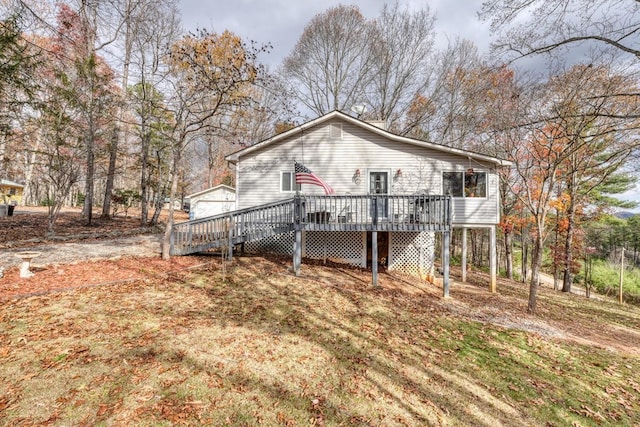 back of house featuring a deck