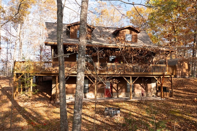 back of house featuring a deck