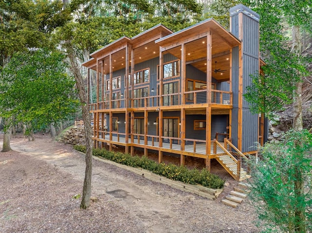 rear view of house with ceiling fan