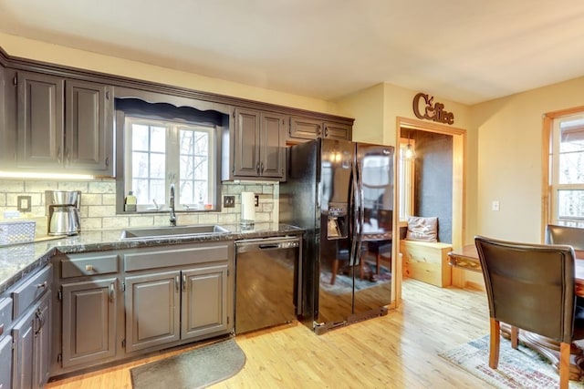 38 Smoky Mtn Rdg, Marble, NC 28905 - kitchen featuring black appliances, a sink, light wood-type flooring, tasteful backsplash, and dark stone countertops