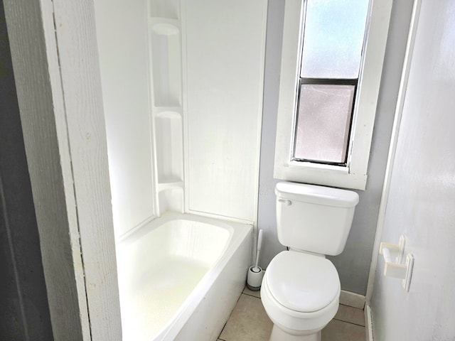 bathroom with tile patterned floors and toilet