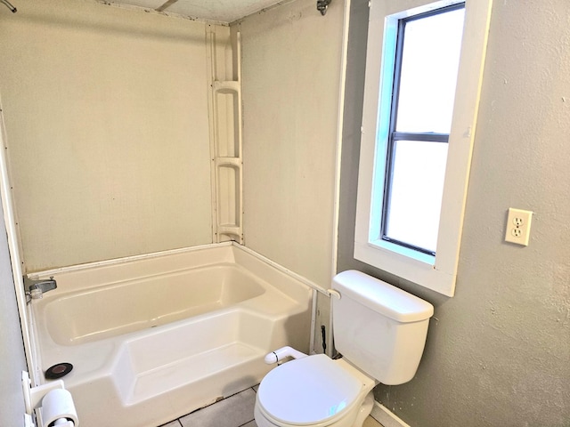 bathroom featuring a bathing tub and toilet