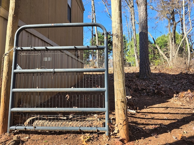 view of gate featuring an outdoor structure