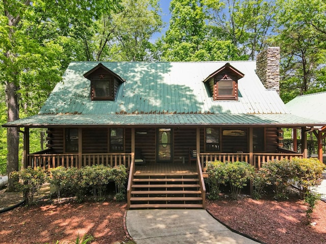 log-style house with a porch