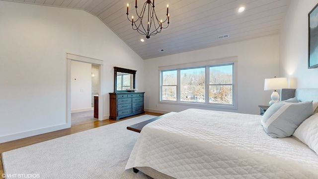 bedroom with light wood-type flooring, wood ceiling, and vaulted ceiling