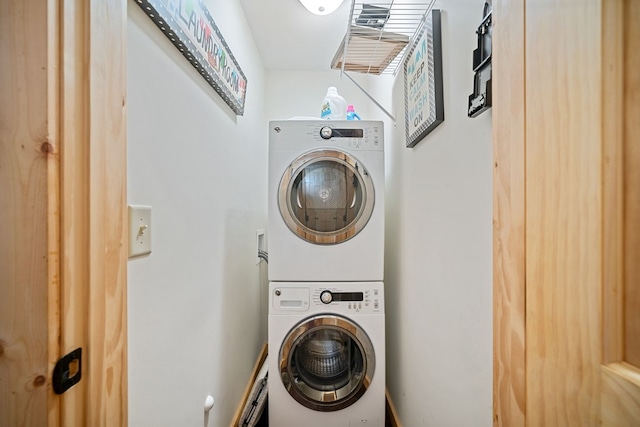 laundry area featuring stacked washer and clothes dryer