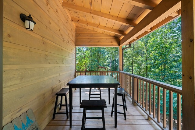 wooden deck with an outdoor bar