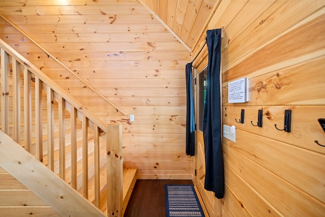 interior space featuring hardwood / wood-style floors, wooden ceiling, and wooden walls