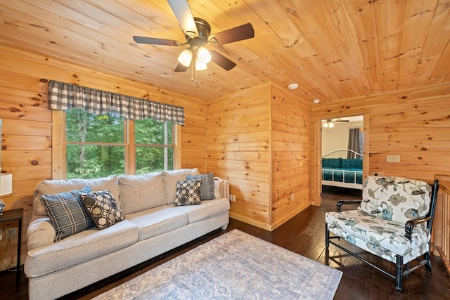 living room featuring wooden ceiling, dark hardwood / wood-style floors, ceiling fan, and wood walls