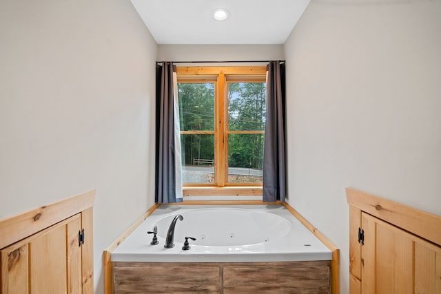 bathroom with a tub