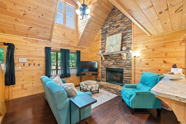 living room with dark hardwood / wood-style flooring, wood ceiling, a stone fireplace, and wood walls