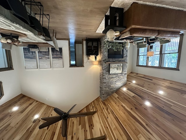 57 Fairview Trl, Morganton, GA 30560 - unfurnished living room with a stone fireplace and wood finished floors
