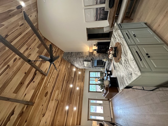 57 Fairview Trl, Morganton, GA 30560 - unfurnished living room with wooden walls, a high ceiling, and a ceiling fan