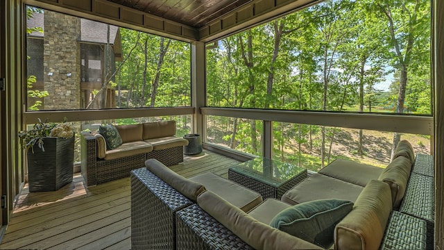 sunroom with an outdoor living space and a wealth of natural light