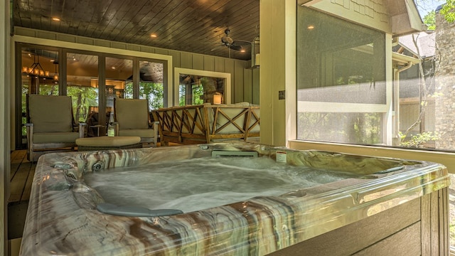 sunroom with a jacuzzi