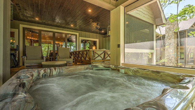 exterior space featuring a jacuzzi