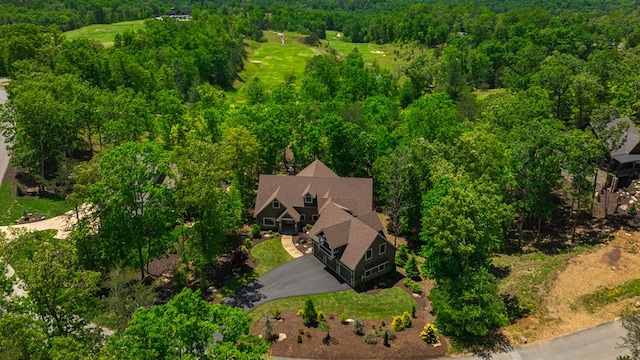 bird's eye view featuring a wooded view