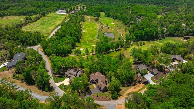 birds eye view of property featuring a residential view, golf course view, and a wooded view