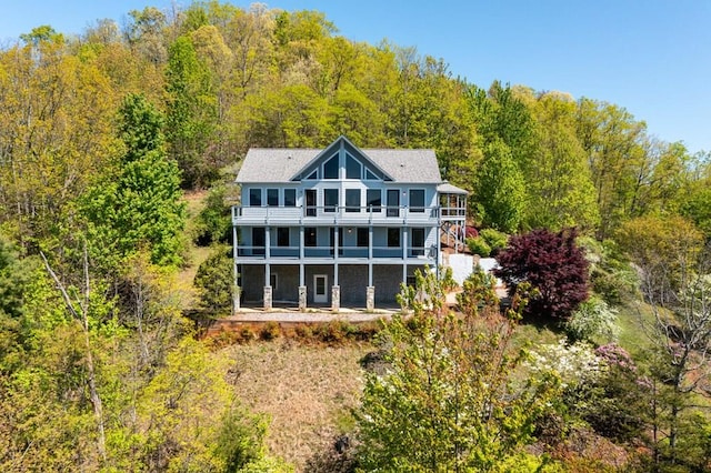 back of property with a balcony