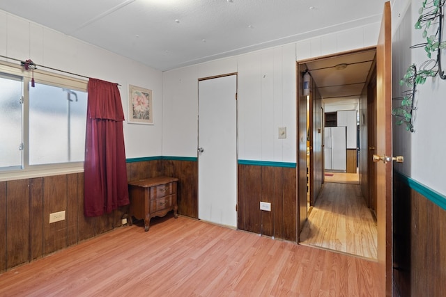 empty room with light hardwood / wood-style floors