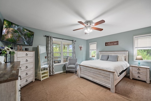 bedroom with carpet floors, a ceiling fan, and baseboards