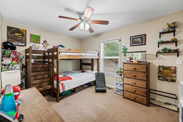 bedroom featuring carpet floors, baseboards, and a ceiling fan