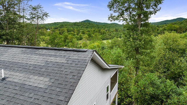 mountain view featuring a heavily wooded area