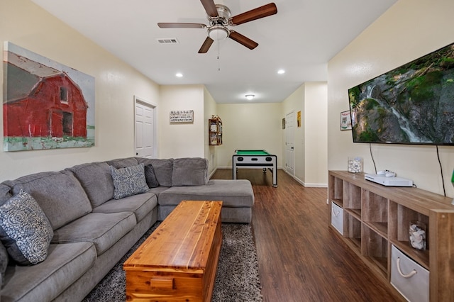 living room featuring dark wood-type flooring, a ceiling fan, recessed lighting, and baseboards
