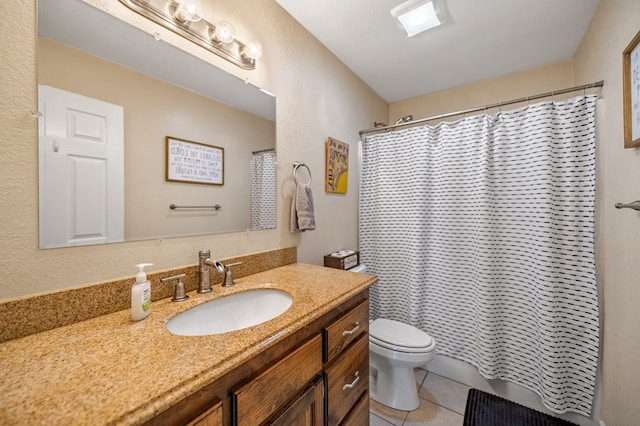bathroom featuring toilet, tile patterned floors, vanity, and shower / bath combo with shower curtain
