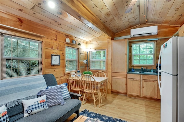 kitchen featuring light hardwood / wood-style flooring, light brown cabinets, wooden ceiling, vaulted ceiling, and white fridge