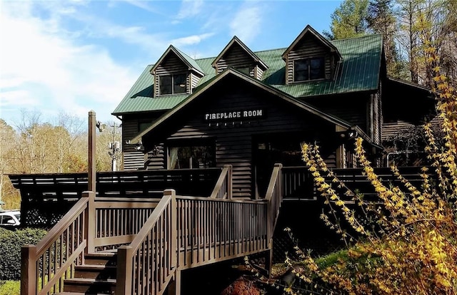 back of house featuring a wooden deck