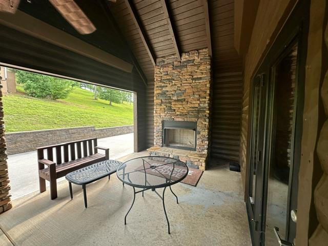 405 Lola Dr, Blairsville, GA 30512 - view of patio with an outdoor stone fireplace