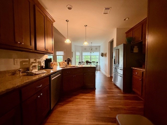 405 Lola Dr, Blairsville, GA 30512 - kitchen featuring stainless steel appliances, a sink, a peninsula, dark wood-style floors, and pendant lighting