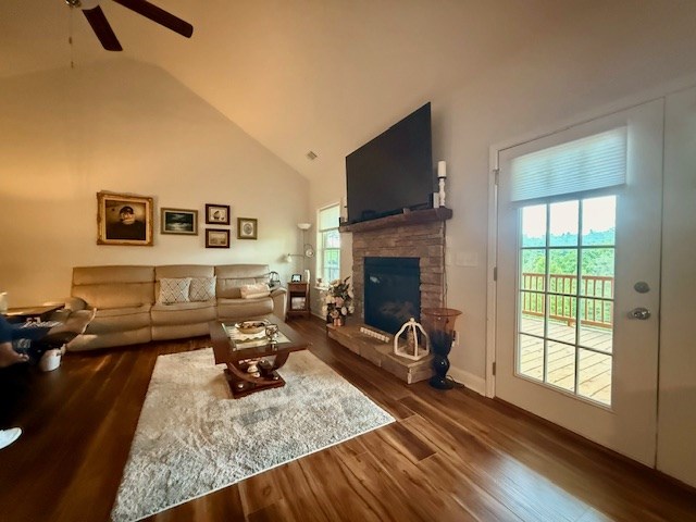 405 Lola Dr, Blairsville, GA 30512 - living room featuring wood finished floors, a fireplace, a ceiling fan, and high vaulted ceiling