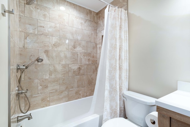 bathroom with shower / tub combo, vanity, and toilet
