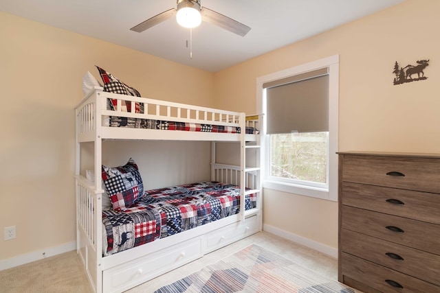 bedroom featuring carpet floors, baseboards, and a ceiling fan