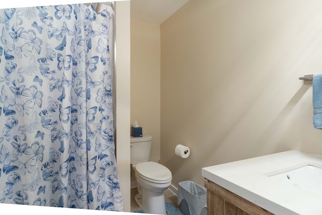 bathroom with toilet and a shower with shower curtain
