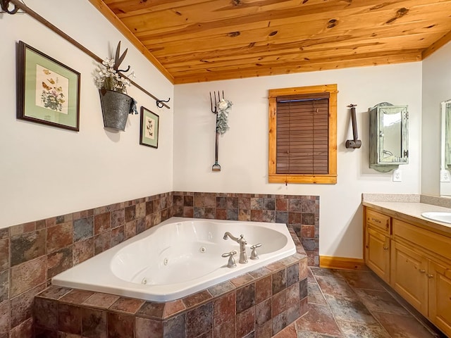 full bathroom with vanity, baseboards, wood ceiling, stone finish flooring, and a jetted tub