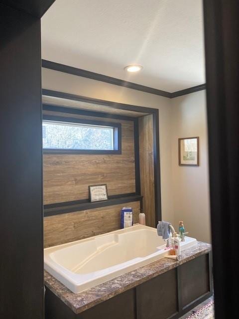 bathroom with a tub to relax in