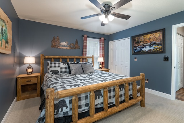 carpeted bedroom featuring a closet and ceiling fan