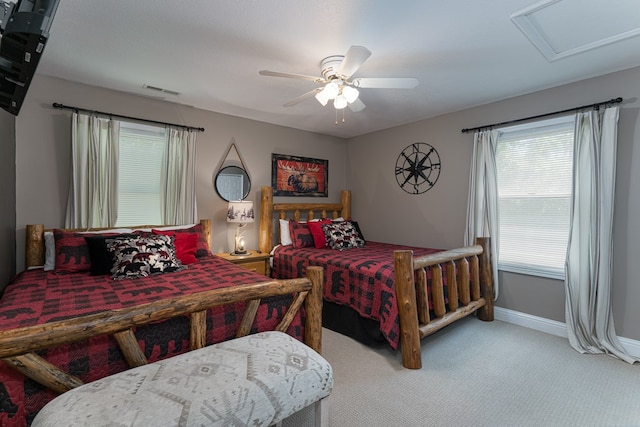 carpeted bedroom with ceiling fan