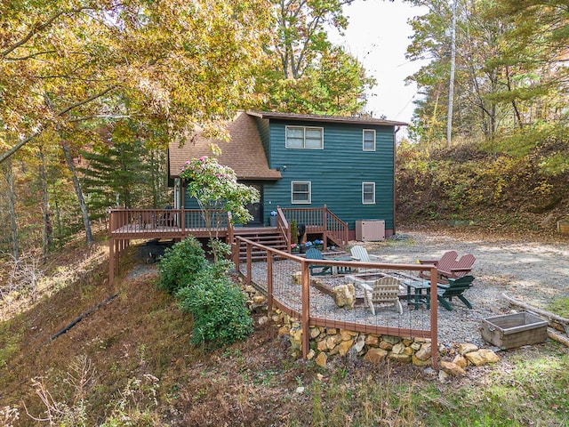 back of house with a wooden deck