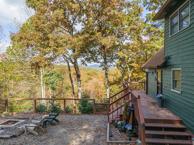 view of yard featuring a deck with mountain view