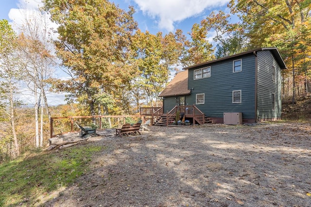 back of house featuring a deck