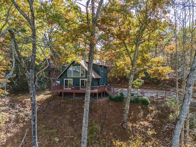 back of house featuring a wooden deck