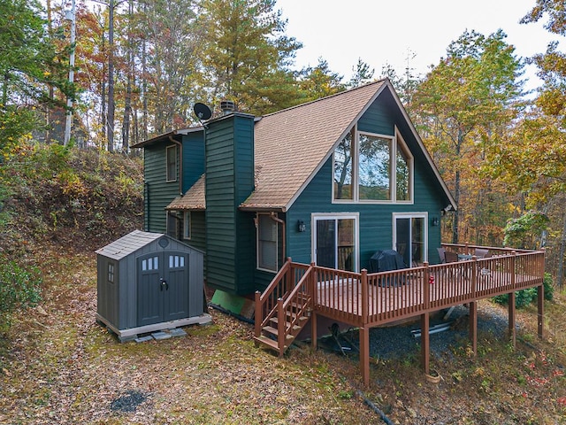 rear view of house featuring a deck