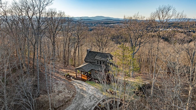 aerial view with a mountain view and a view of trees